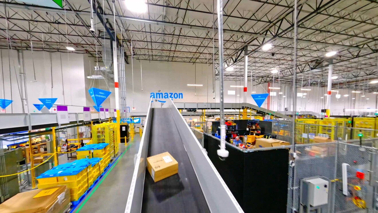 A box goes up a conveyor belt at an Amazon fulfillment center.