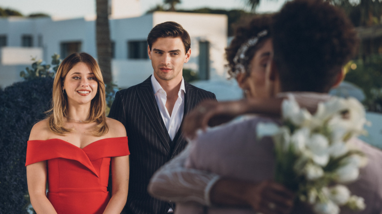 Couple posing for photographer at formal event