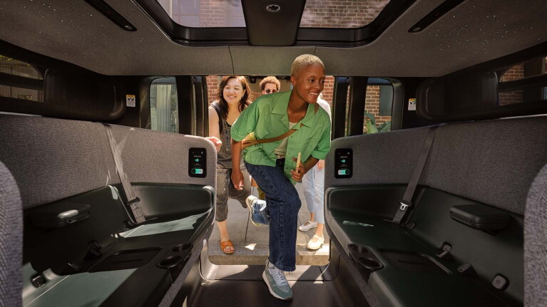 An image of a group of people getting into a Zoox car.