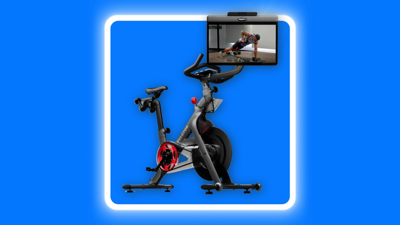 A Peleton stationary bike against a blue background.