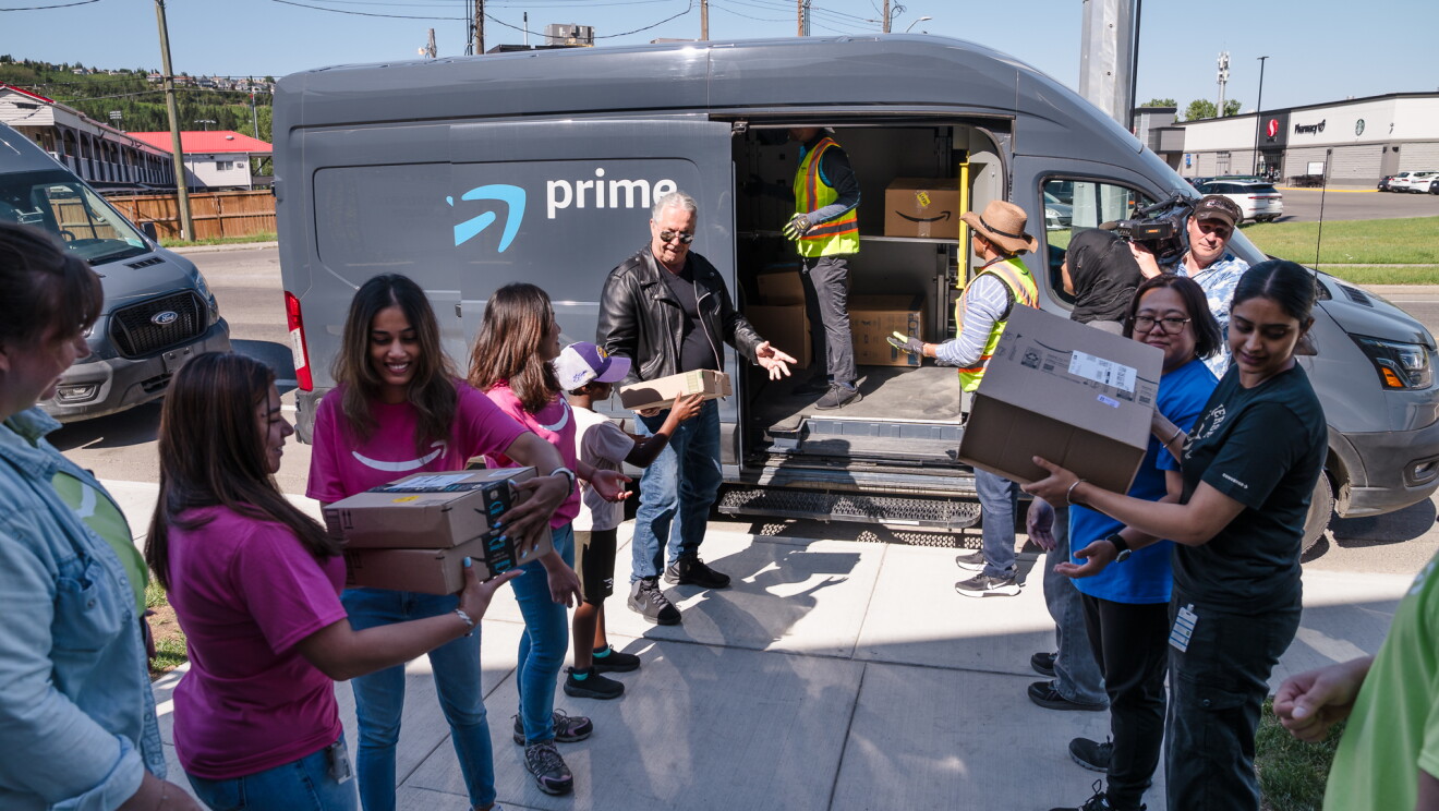 Bret "The Hitman" Hart helping to load an Amazon delivery van.