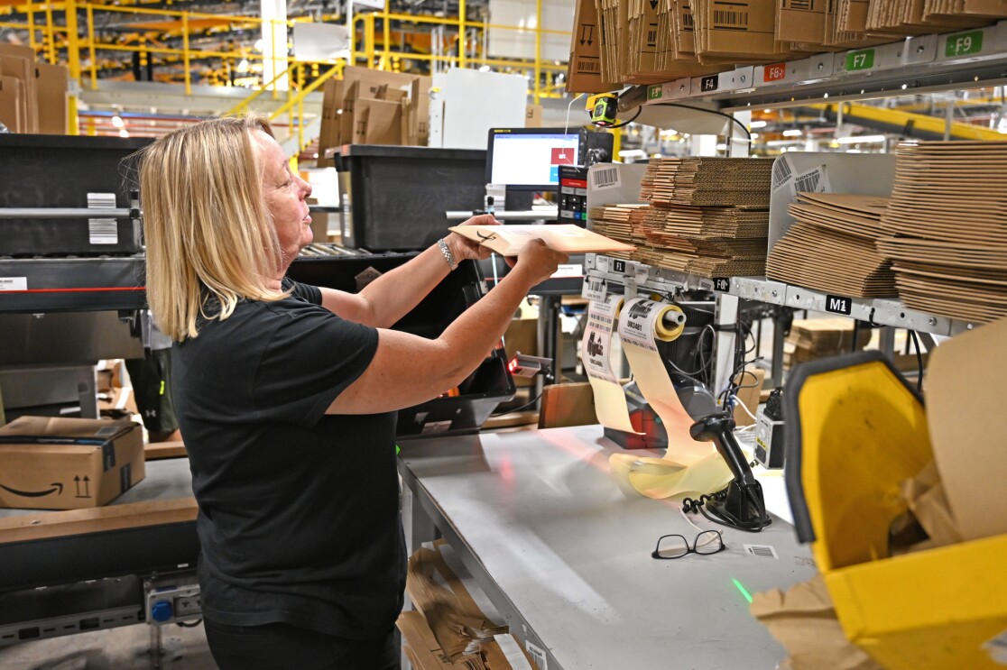 BRS1 employee Cheryl Knight at her packing station