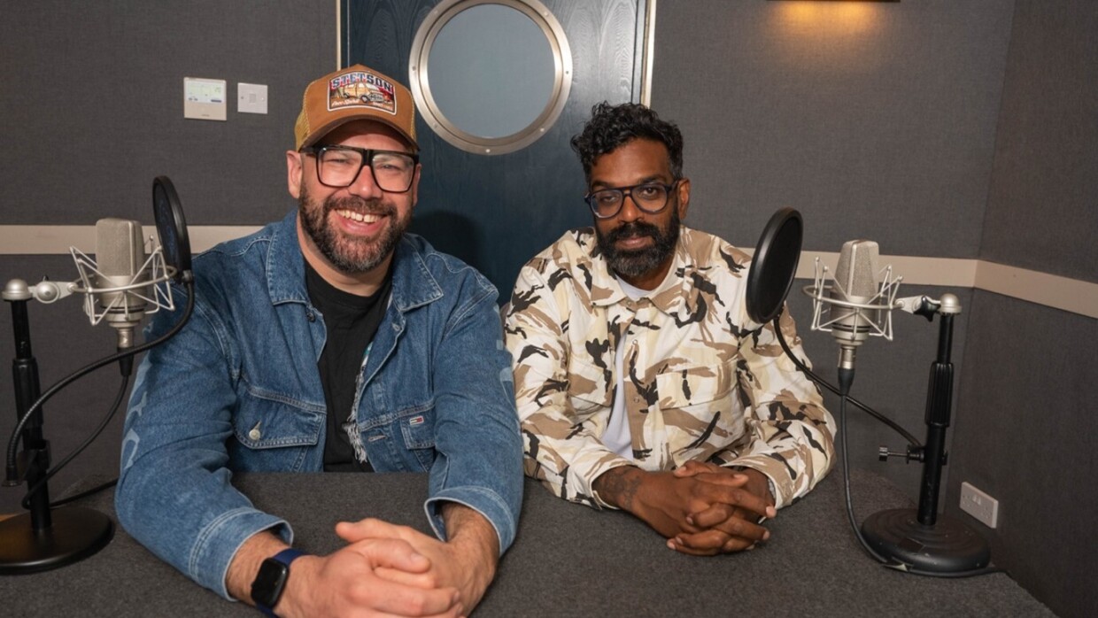 Comedians Romesh Ranganathan and Tom Davies in a podcast studio