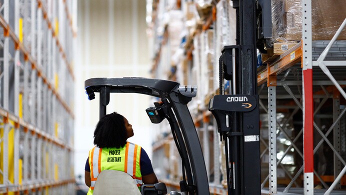 A volunteer helps pack donated supplies at an Amazon fulfillment center to support Hurricane Ian relief
