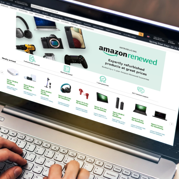 Image of hands on a laptop. The screen shows the Amazon Renewed shopping page.