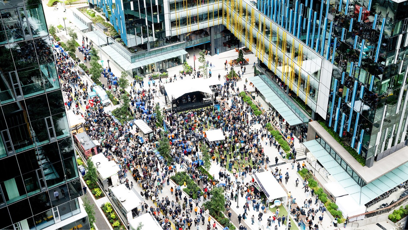 An image of a group joining together at the Amazon Web Services event at Amazon's headquarters in Seattle