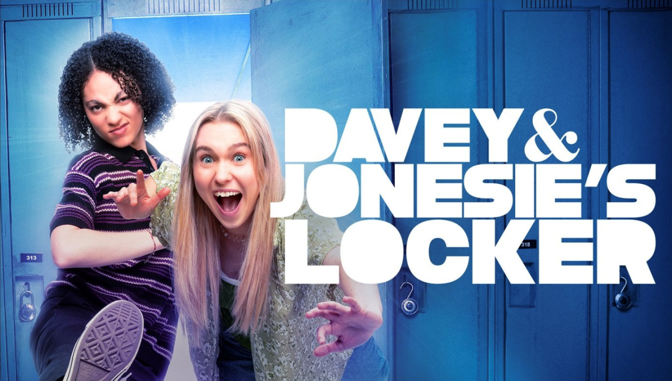 2 girls are coming out of the locker; Davey is kicking while Jonesie has a big smile and she's pushing out of the locker. 