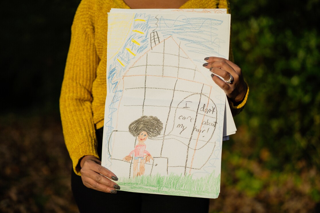 Self portraits of students shared with Crystal Swain-Bates after she participated in a book reading at a school.