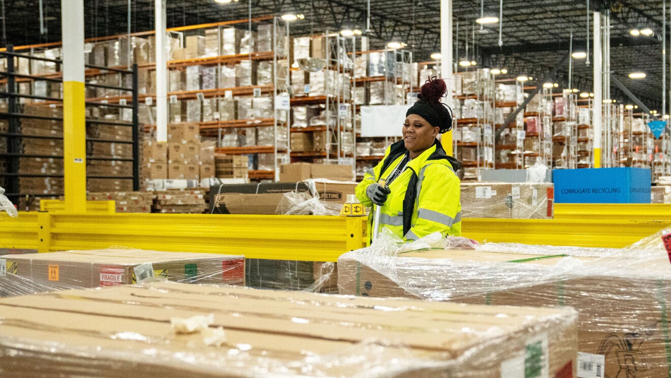 Amazon employee works in a fulfillment center.