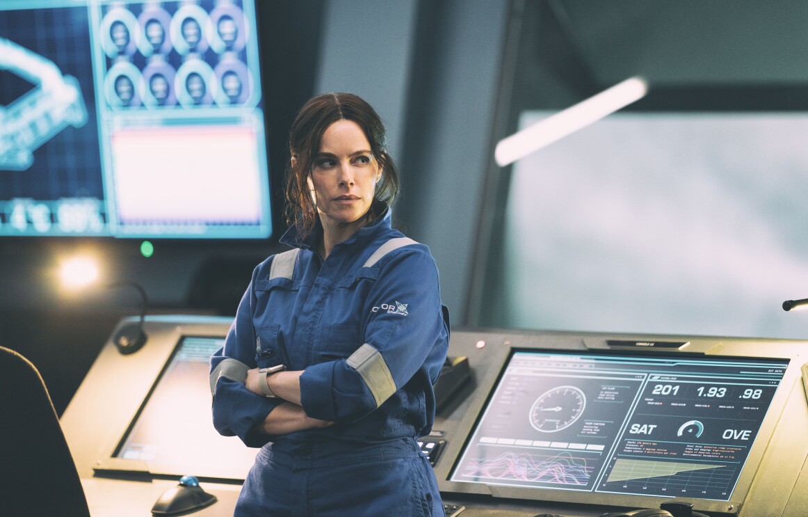 Emily Hampshire wearing a blue jumpsuit in The Rig season 2