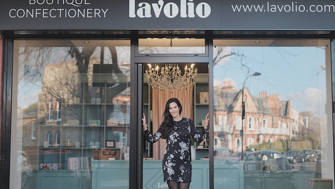 Lavina business owner stood outside shop front 