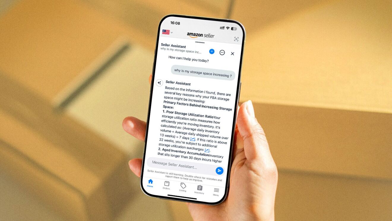 Hand holding smartphone displaying Amazon Seller Assistant chat about storage space