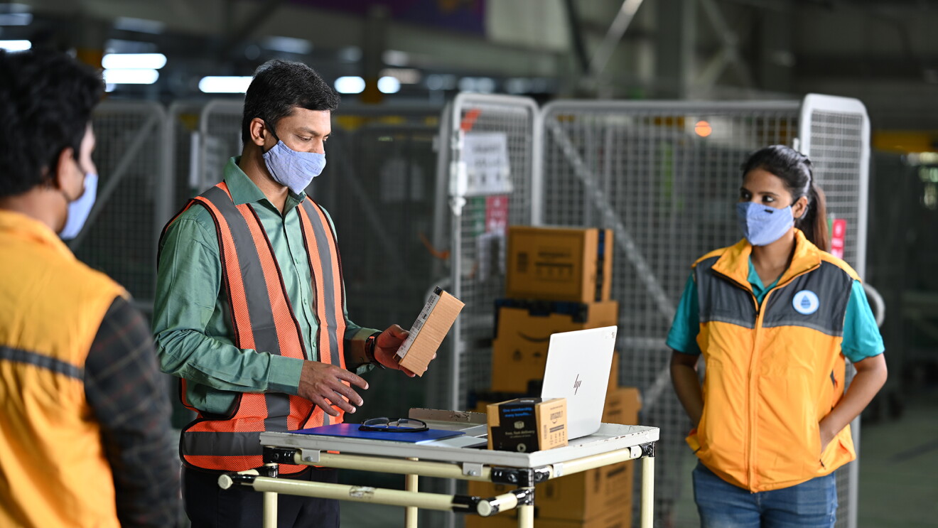 Amazon’s Delivery Service Partner working with his teammates