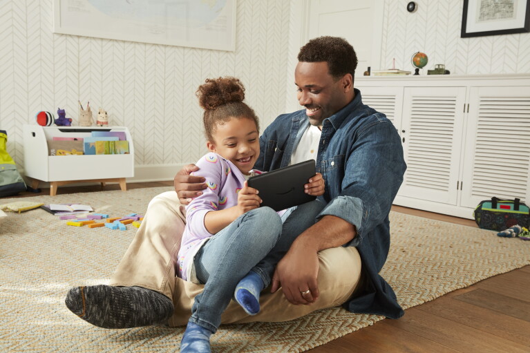 Father and daughter use a Fire Tablet
