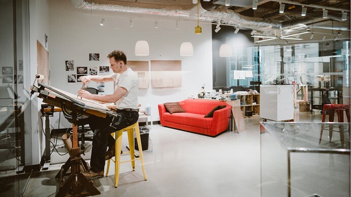 Artist from the Artist in Residence in program work on their respective art.