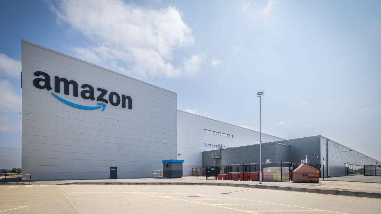 Amazon fulfillment center exterior with logo on white building