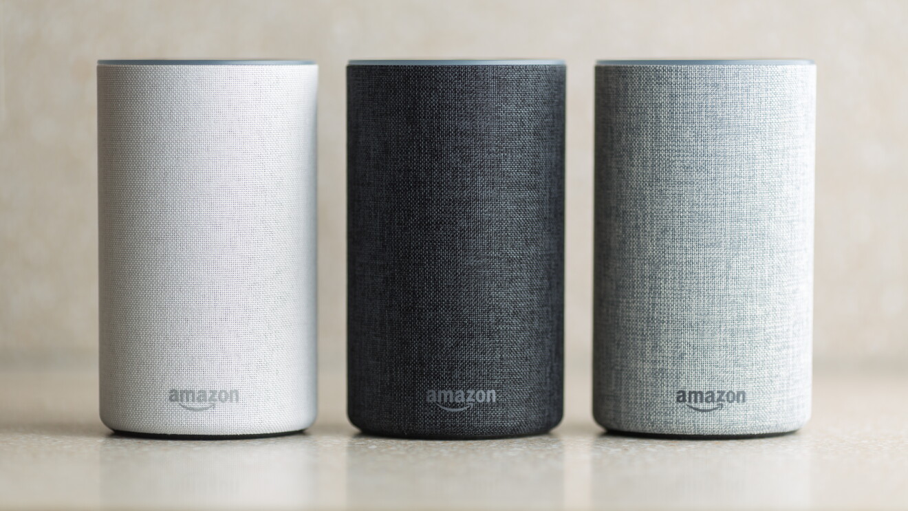 A trio of Amazon Echo devices in white, black, and grey.