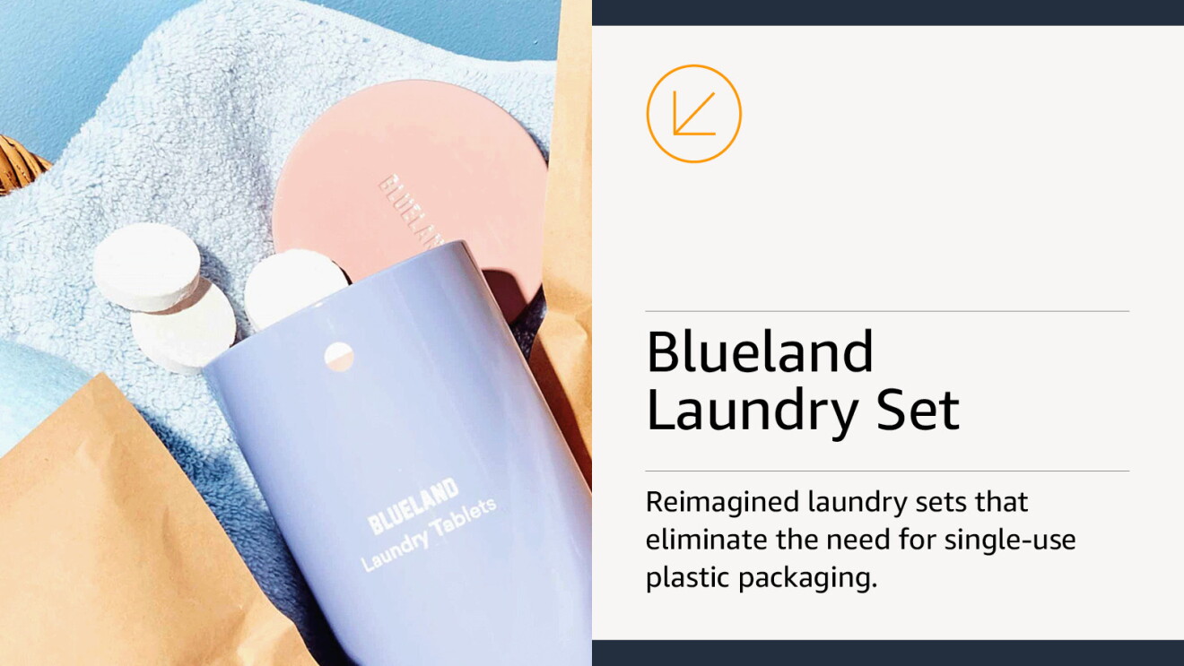 White laundry tablets tumbling out of a metal container, all sitting in a laundry basket
