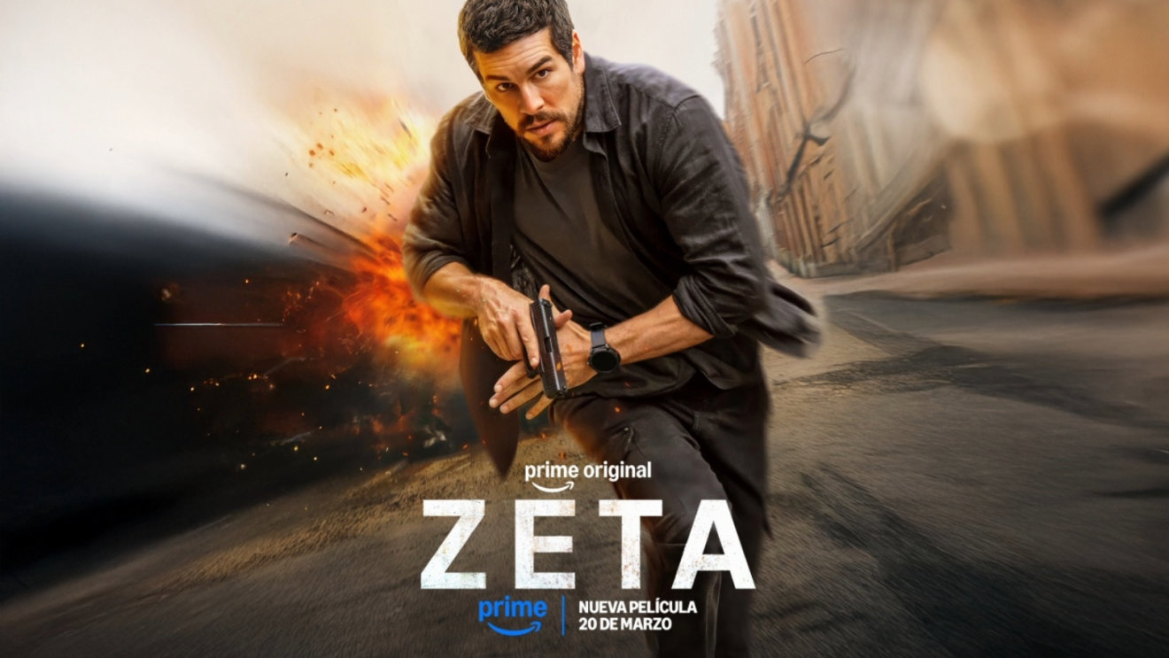 Mario Casas on the cover of the Zeta poster, holding a gun with an explosion in the background