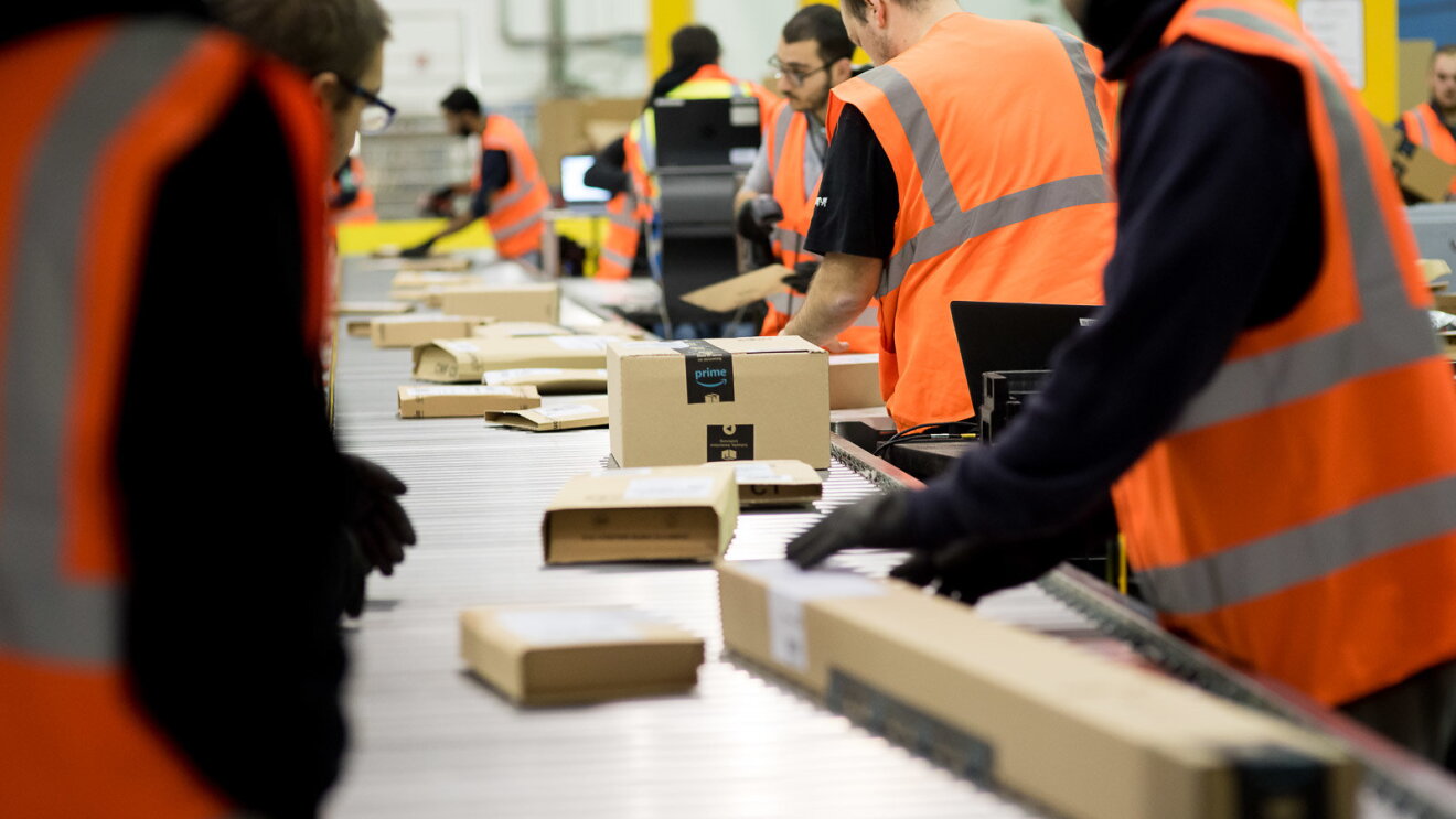 Amazon Fulfillment Center employees working 