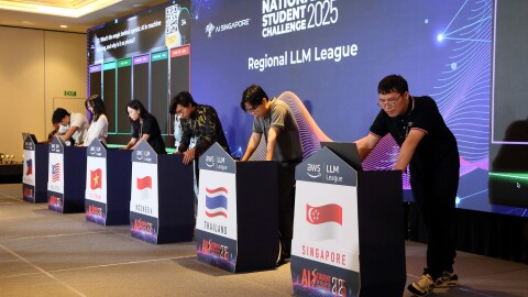 ASEAN LLM League - Participants coding on stage