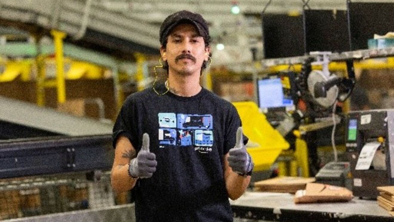 Amazon employee giving thumbs up 