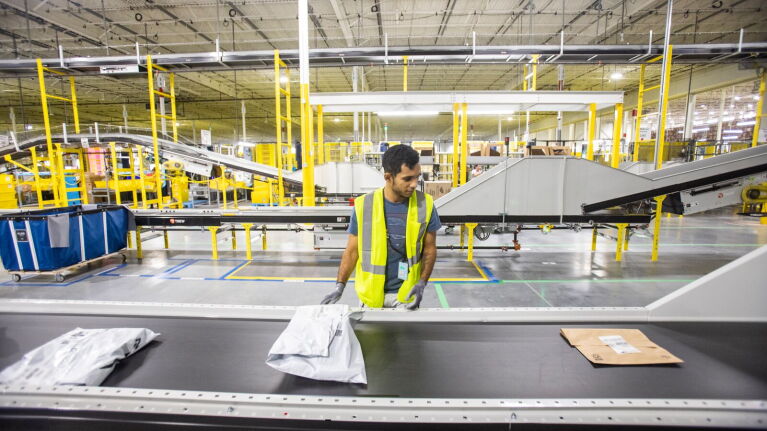 An Amazon employee working in a Tampa fulfillment center.