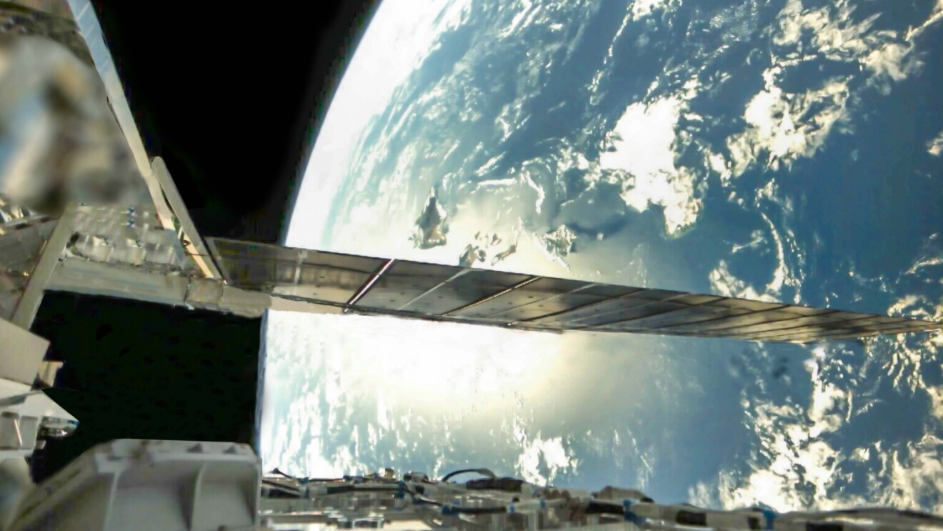 Amazon Leo satellite extending over Earth's blue curvature