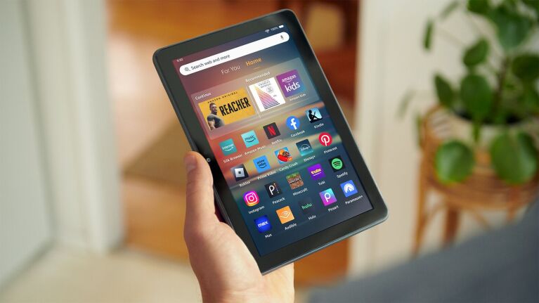 Hand holding an Amazon Fire HD 8 tablet