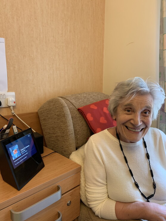 Ruth, one of the residents of Hampton Care home, near her Echo Show device