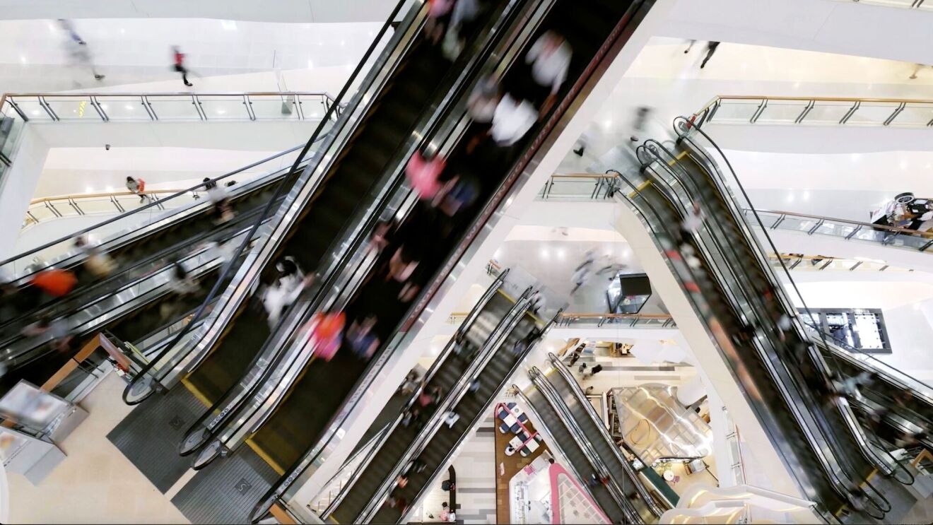 An image of the inside of a building showing several staircases on different floors.