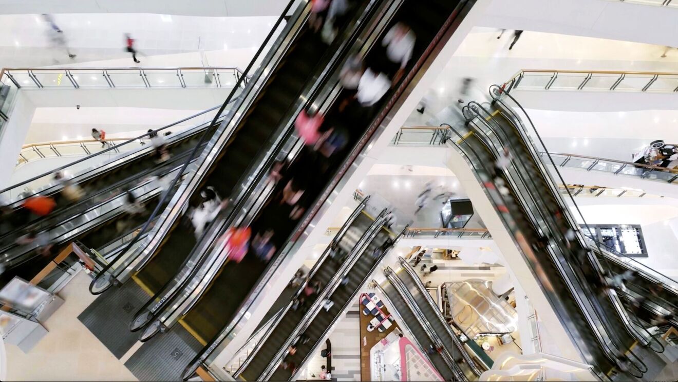 An image of the inside of a building showing several staircases on different floors. 