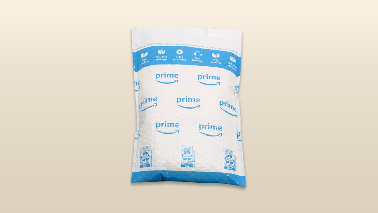 An image of an amazon package with a beige background.