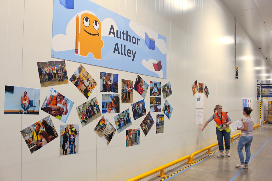 Eilish in front of the author wall at LTN5.