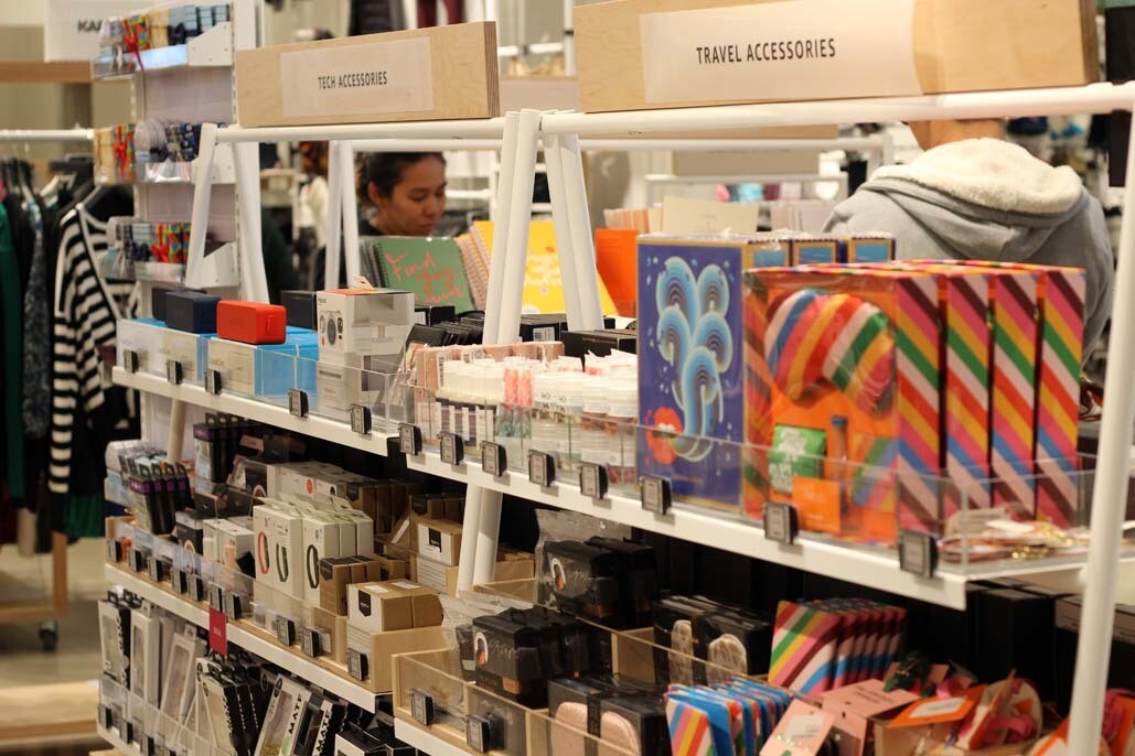 An image of shelves with small tech and travel accessories at the Amazon Style store in Los Angeles.