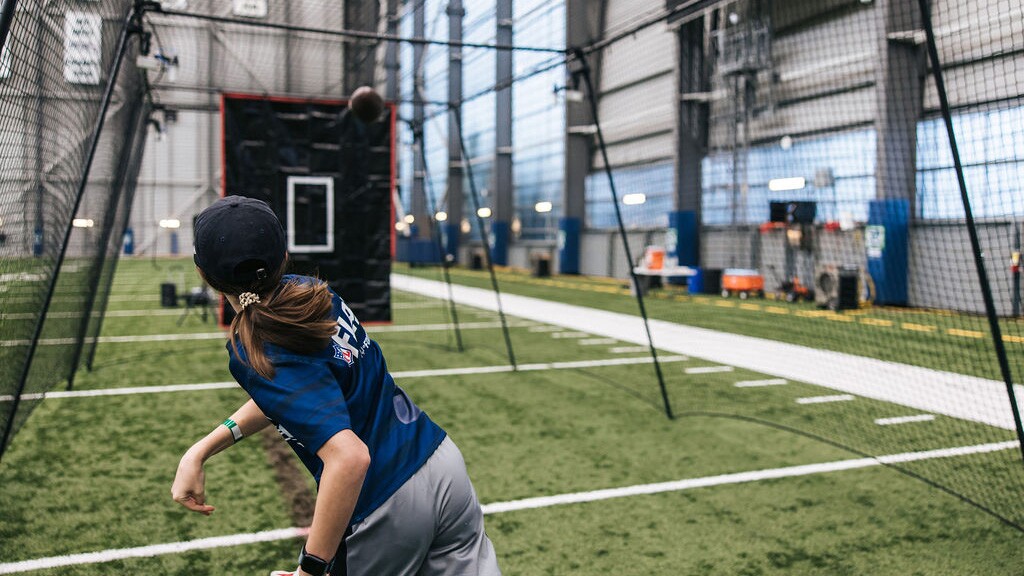 Indoor sports complex with player practicing football
skills