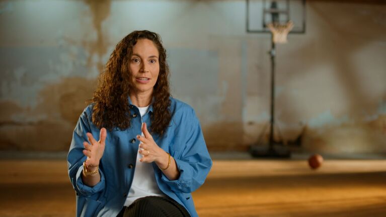 WNBA star Sue Bird talks during an interview.