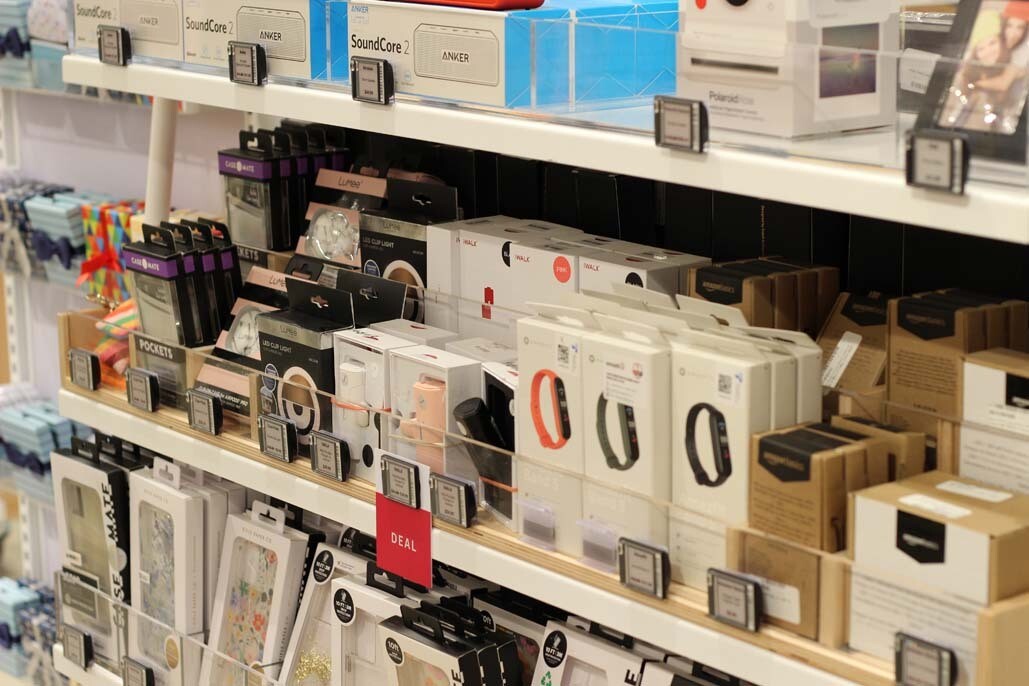 An image of shelves with small tech and travel accessories at the Amazon Style store in Los Angeles.