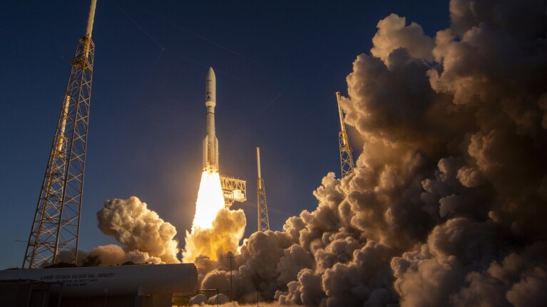 Rocket launch with fiery exhaust and billowing smoke clouds