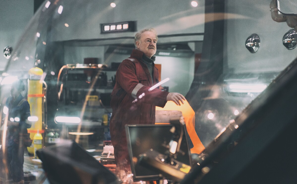 Owen Teale wearing a red jumpsuit in The Rig season 2
