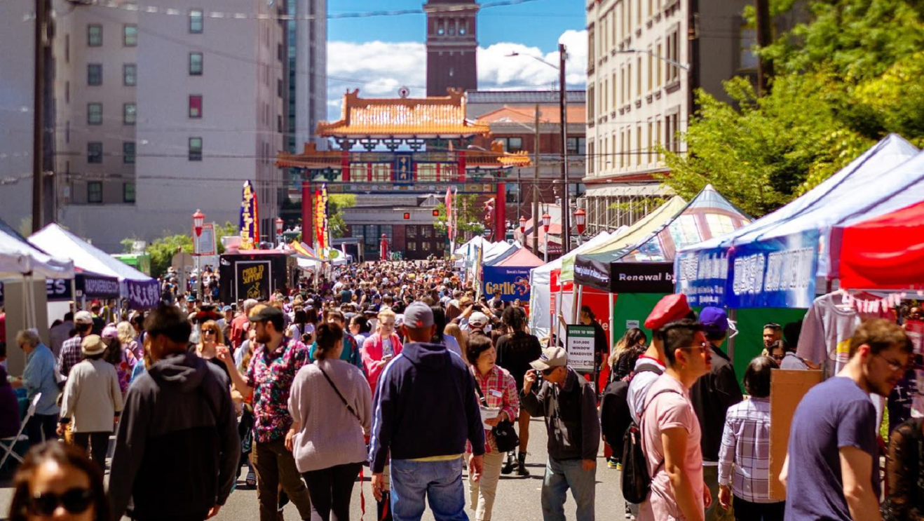 An image of people walking down the street during Seattle's Chinatown-International District annual Night Market.