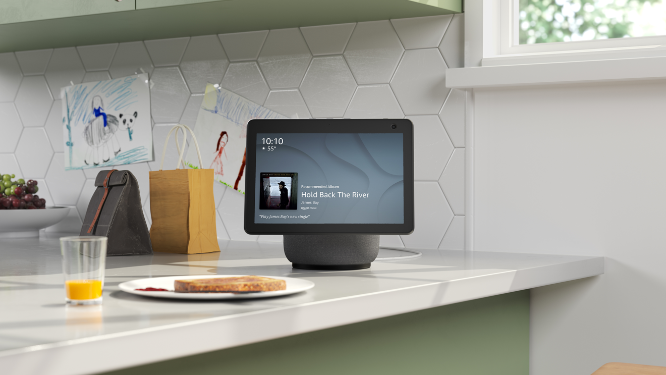An image of an Alexa Show sitting on a kitchen counter top. 