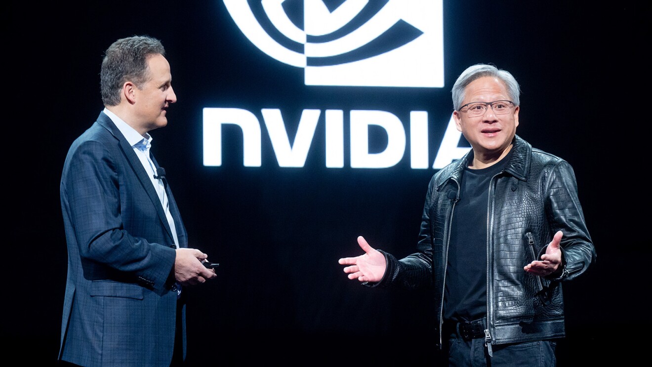 A photo of AWS CEO Adam Selipsky and NVIDIA CEO Jensen Huang on stage at AWS re:Invent 2023.