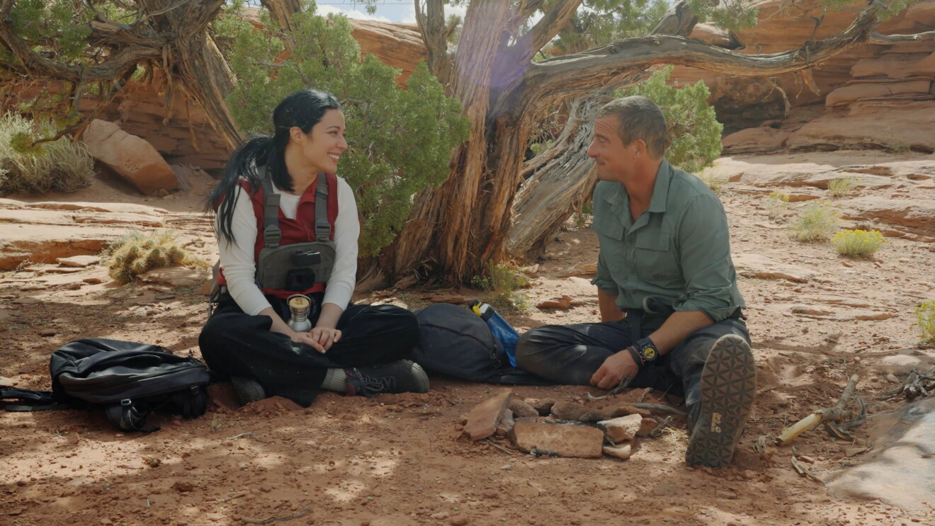 two people sitting on the ground