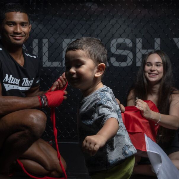 MMA fighter Amir Khan with his wife and child.