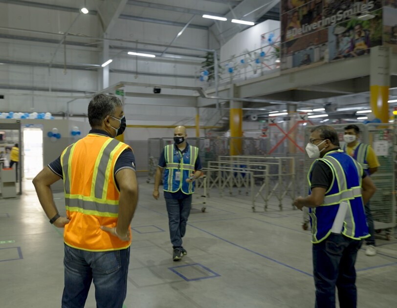 akhil saxena talking to associates