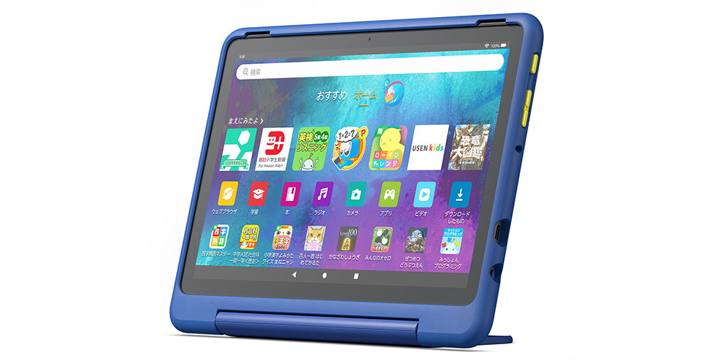 斜めから見たタブレットの製品画像。紺色のフレームで、画面には子供の学習用アプリのアイコンが多数表示されている。