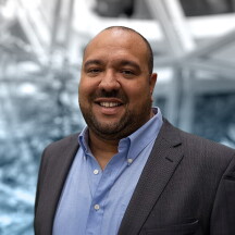 A headshot of Abe Diaz.