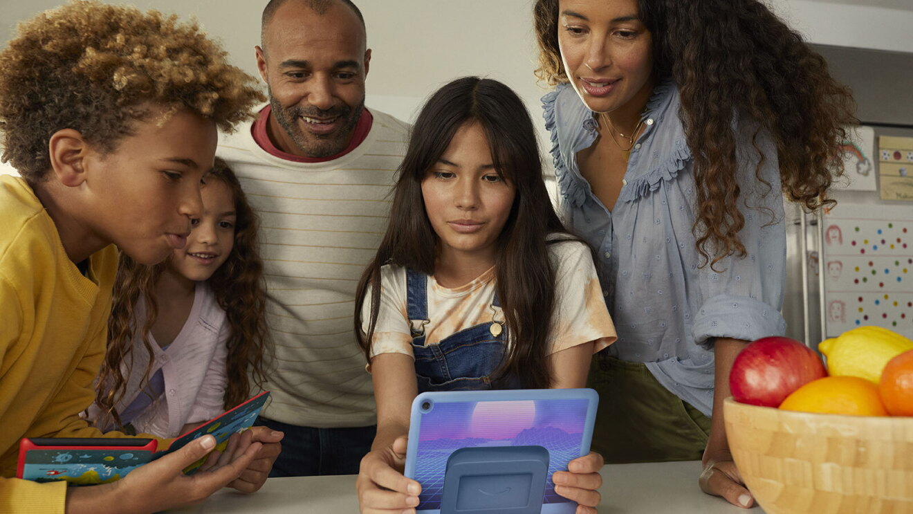 An image of a child using Amazon's Kids Fire Tablet in their home.