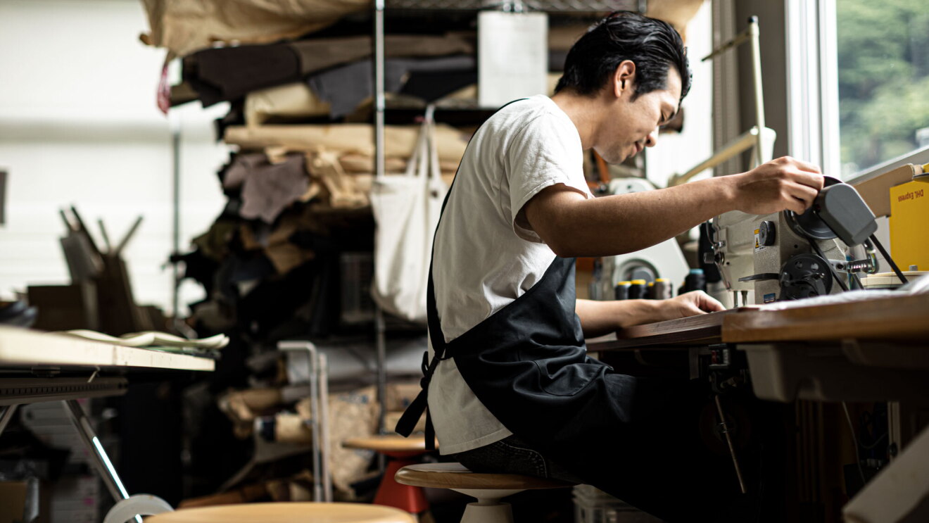 A craftsman works at his station.